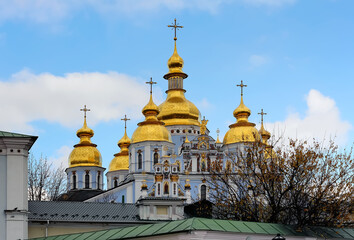 Fototapeta na wymiar Tops of St. Michael's Golden-Domed Monastery in Kyiv, Ukraine