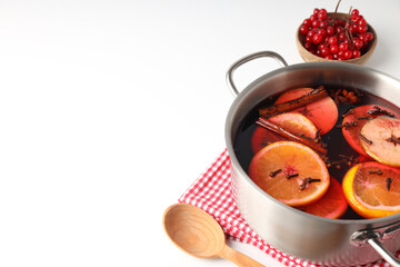 Concept of cooking  mulled wine on white background