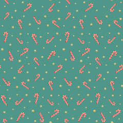 Vector seamless pattern with christmas candy canes and golden stars at blue background
