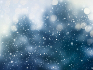 Abstract winter background. Falling snowflakes on a blurred background of trees. design concepts