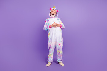 Full length body size view of attractive cheerful grey-haired man resting having fun isolated on violet purple color background