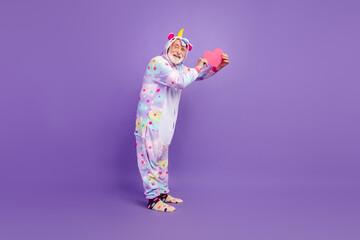 Photo of charming funky retired man nightwear overall smiling showing you pink heart isolated purple color background