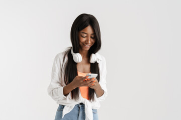 Fototapeta premium Smiling young african woman with long dark hair