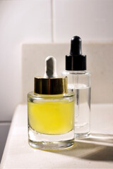 skin serum pipette containers on bathroom vanity unit