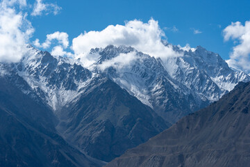The majestic Hindu Kush mountains rising in the background along the Wakhan Corridor, Tajikistan.
