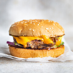 cheeseburger burger homemade bun, cheese, vegetable, grilled cutlet minced meat pork, beef fast food meal snack copy space food background rustic 