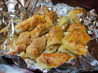 Homemade rolled buns with walnuts wrapped in the foil