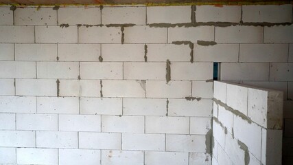 Fragment of a wall made of plaster blocks. Lightweight materials for interior partitions. Close-up. Construction of internal partitions in the house.