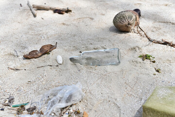 Dirty waste and unuseful rubbish plenty on the beach