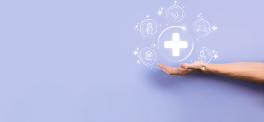 Businessman hold virtual plus medical network connection icons. Covid-19 pandemic develop people awareness and spread attention on their healthcare.Doctor,document,medicine,ambulance,patient icon.