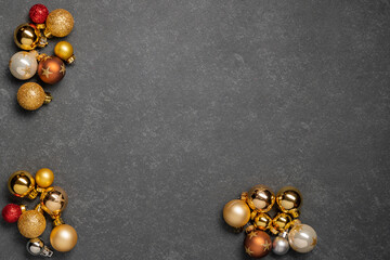 christmas baubles on dark background gold red white