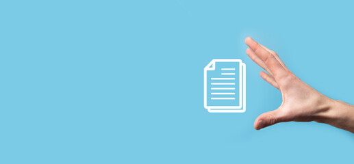 Male hand holding a document icon on blue background. Document Management Data System Business...