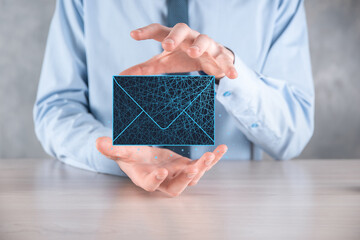Businessman hand holding letter icon,email icons.Contact us by newsletter email and protect your...