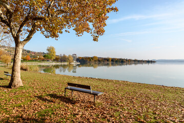 Autumn landscape of Lake Varese with Lakeside promenade in Gavirate, province of Varese, Italy.