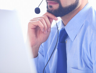 Businessman in the office on the phone with headset, Skype, FaceTime