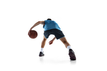 Back view of professional basketball player in blue sports uniform training isolated on white studio background.