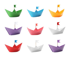 Set with multicolor paper boats on white background
