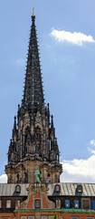 Fototapeta na wymiar View of the tower peak of the memorial St. Nikolai in Hamburg, Germany