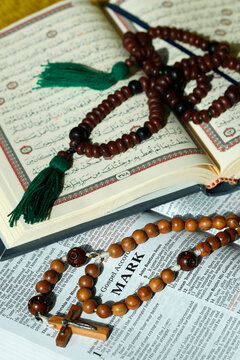 Bible, Quran, Crucifix and Prayer Beads, interfaith symbols of Christianity and Islam, the two largest religions in the world, Dubai, United Arab Emirates