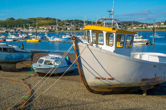 View of boats on the beach with Conwy River visible in background, Conwy, Gwynedd, North Wales