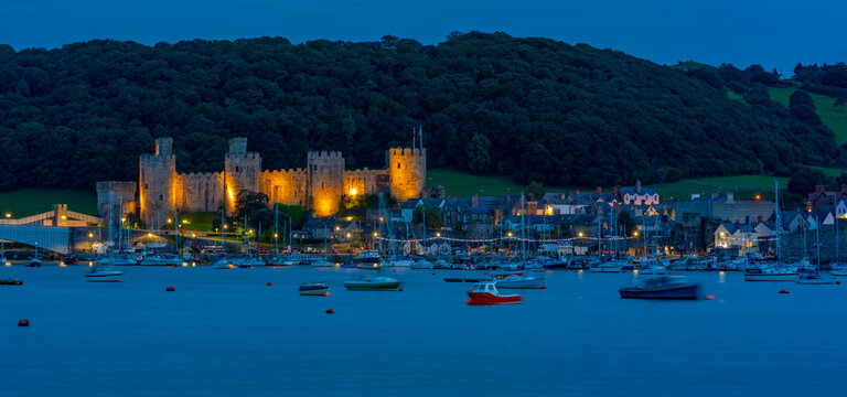 View of Conwy Castle, UNESCO World Heritage Site, and Conwy River at dusk, Conwy, Gwynedd, North Wales