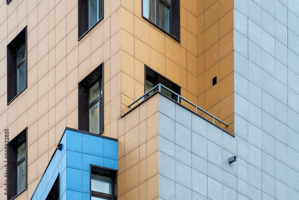 Poster close up view of corner of modern apartment building with balcony. view of fragment of facade and en