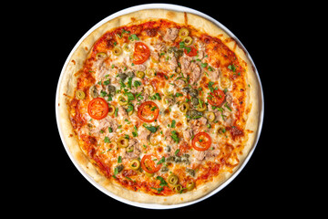 Delicious pizza close up, white plate on black background