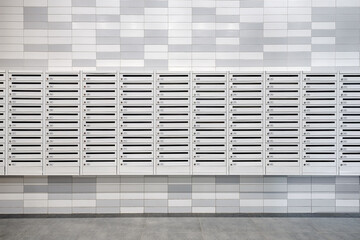 A lot of new mailboxes in an apartment building. New building, mailboxes in the lobby of an...