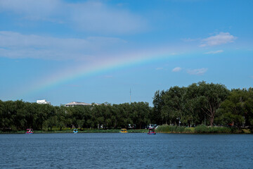 Fototapeta na wymiar rainbow on the lake