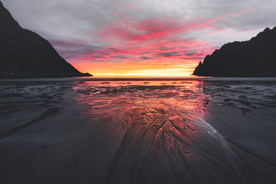 Empty Ersfjord beach against the cloudy sky and midnight sun, Senja island, Troms county, Norway, Scandinavia
