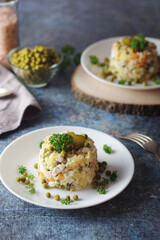 Olivier salad, traditional Russian dish, served on the plate