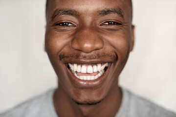 Closeup of a carefree young African man laughing