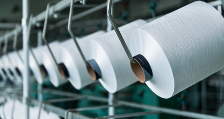 Textile industry - yarn spools on spinning machine