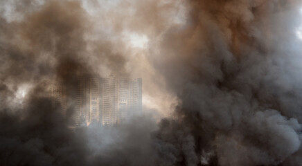Fototapeta na wymiar Thick dark smoke over a fire