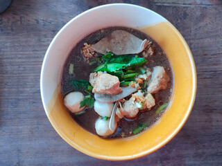 Thai boat noodles is Thailand's most famous noodles soup,Thai Boat noodles soup or Guay tiew reua ,Rice noodles thicken soup with stewed pork and pork ball