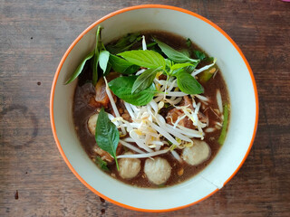 Thai boat noodles is Thailand's most famous noodles soup,Thai Boat noodles soup or Guay tiew reua ,Rice noodles thicken soup with stewed beef and beef ball