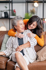 happiness asian family candid of daughter hug grandparent mother senior elder mom cozy relax on...
