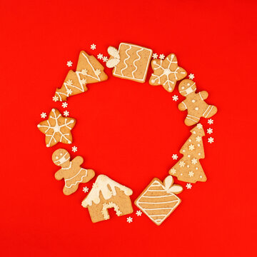 Happy New Year 2022 Wreath. Christmas, winter holidays concept. Set of Gingerbread cookie, stars, man in medical mask on traditional red background, Trendy fleyer, invitation, greetincard, banner