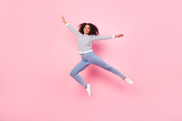 Fototapeta na wymiar Full size photo of cheerful charming lady enjoy jumping isolated on pink color background