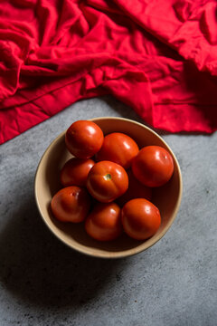 Red colour background of fresh tomatoes. Close up, selective focus. 