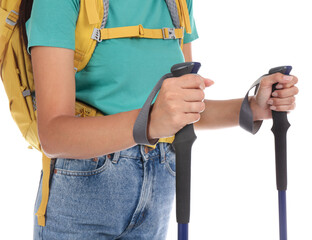 Woman with backpack and trekking poles on white background, closeup