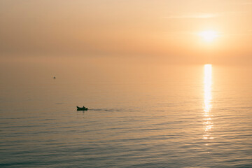 Fototapeta premium Silhouette of kayaks on the sea during sunset