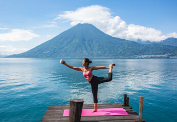 Fototapeta na wymiar Morning yoga on the dock, San Marcos, Lake Atitlan, Guatemala