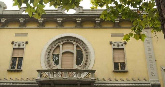 Secessionist house. Circular window of a secessionist house.Quaroni house in Novara inspired by the principles of the Viennese secession. 