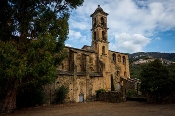 Fototapeta na wymiar the convent of sanfrancescu ,oletta corsica against a blue sky