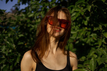 pretty woman in swimsuit and sunglasses summer tropics