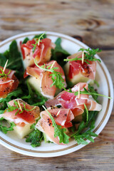 Melon, jamon, arugula appetizer.
