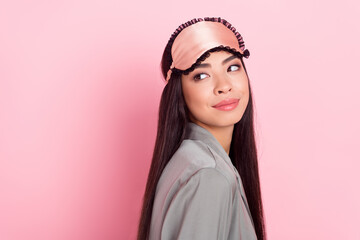 Profile side view portrait of attractive pensive girl looking aside copy blank space isolated over pink pastel color background