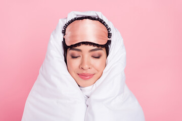 Photo of sweet shiny woman nightwear mask smiling rolling duvet closed eyes isolated pink color background