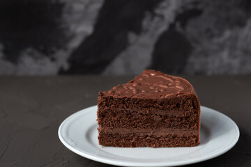 Brown cake isolated on the black background